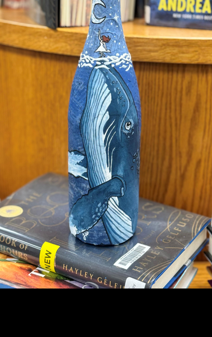 wine bottle with a whale painted on it