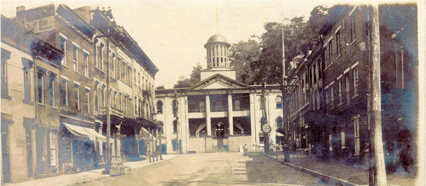 early photo of Court Street in Pomeroy, featuring the Meigs County Courthouse