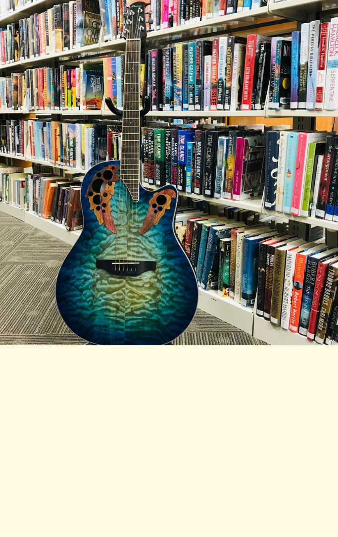 blue guitar in the stacks at the Pomeroy Library